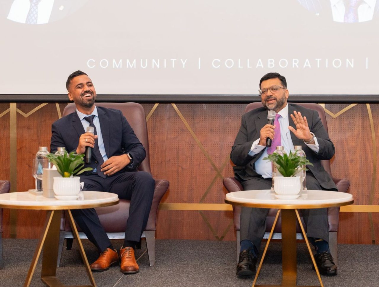 Two speakers on stage at a Business Breakfast